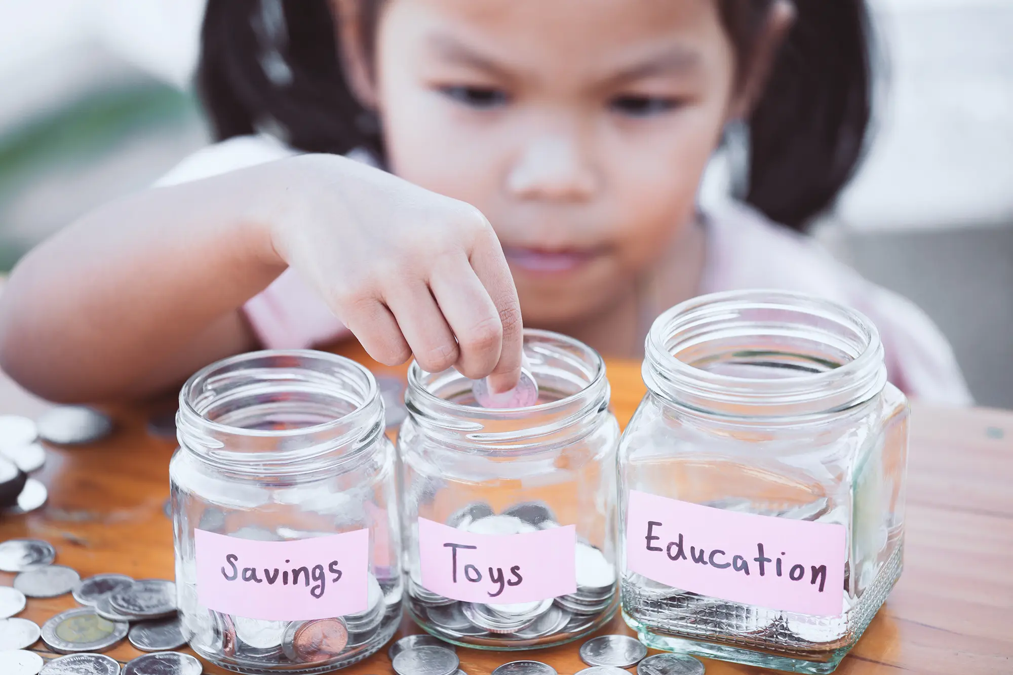 Child with money in jars