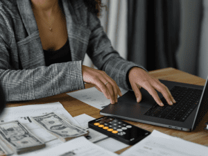 An image showing a woman putting a budget together